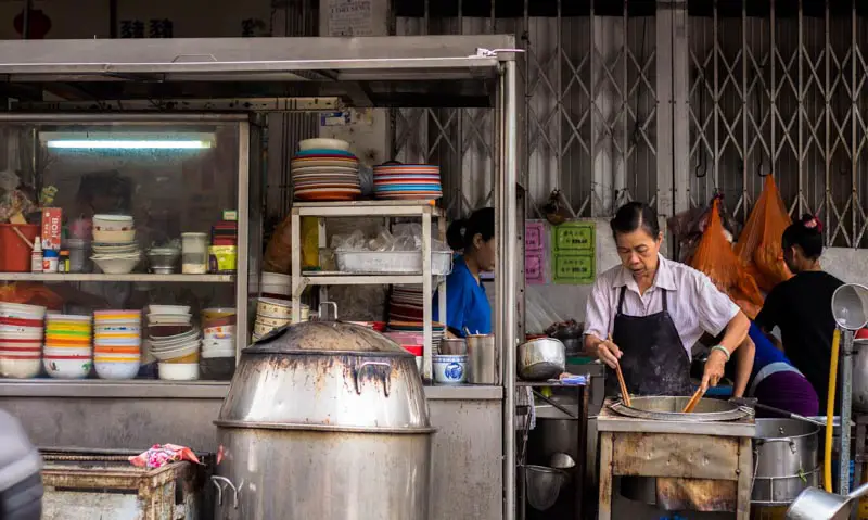 woman cooking at penang night market