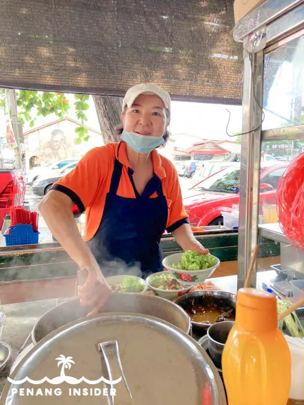 One of Kim Laksa's happy aunties serving some of Balik Pulau's most famous Penang Asam Laksa