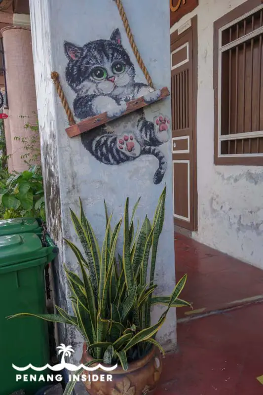 Penang Street Art Cat on a swing