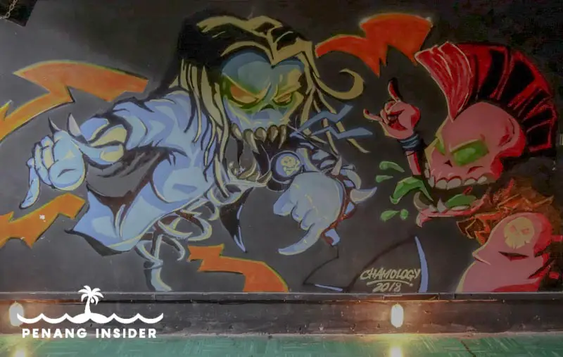 demonic singer and skeletal punk mural inside of Soundmkaer club in Penang Malaysia street art