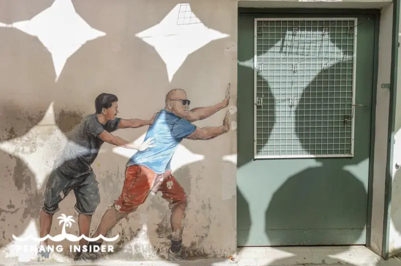 Penang Street Art Two Men Pushing Door
