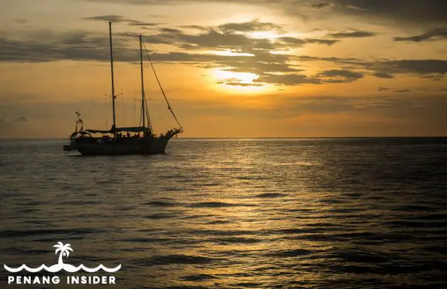 Yacht sailing against the sun in a Langkawi sunset cruise