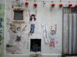 Street art of kids jumping in Market Lane, Ipoh, Perak