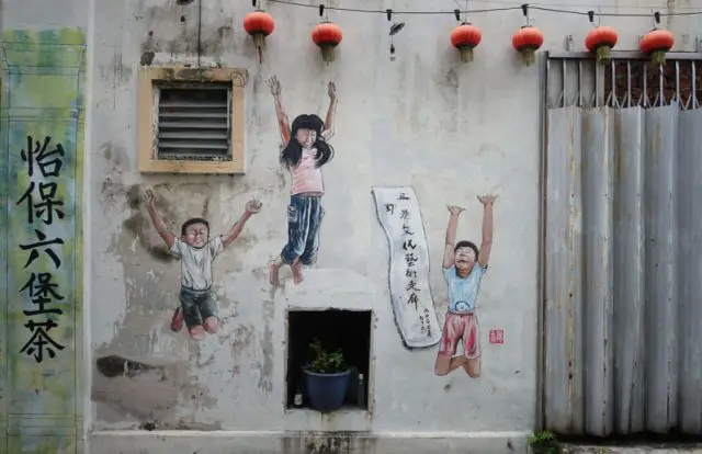 Street art of kids jumping in Market Lane, Ipoh, Perak